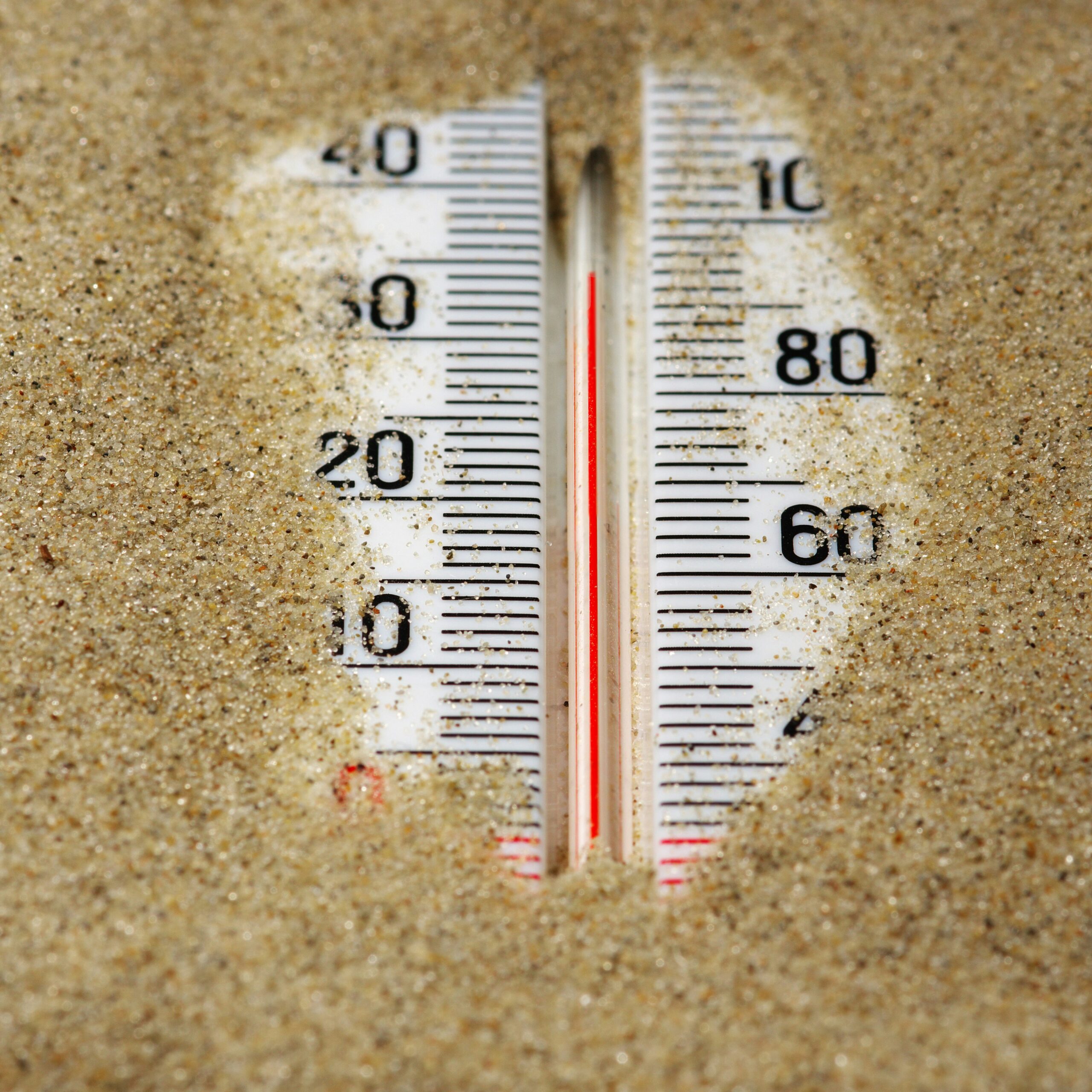 a hot thermometer buried in the sand on a summer day to emulate the heat felt when not implementing nonprofit retention strategies